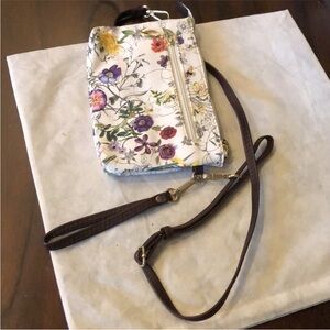 NWOT Convertible crossbody wristlet zippered areas floral faux leather bag